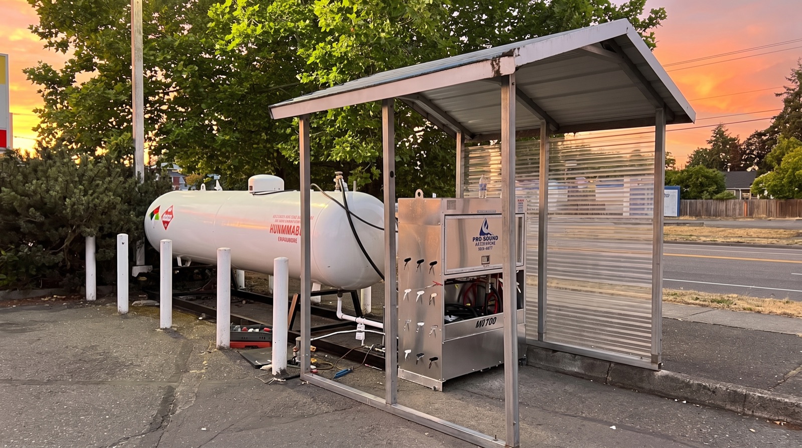 A propane cylinder exchange and refill station at a fuel retailer